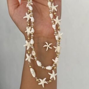 a hand holding a necklace